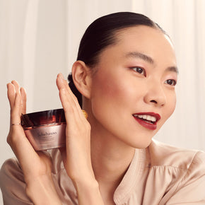 Timetreasure Invigorating Cream, anti-aging, fine lines and wrinkles, luxury skincare, model holding jar