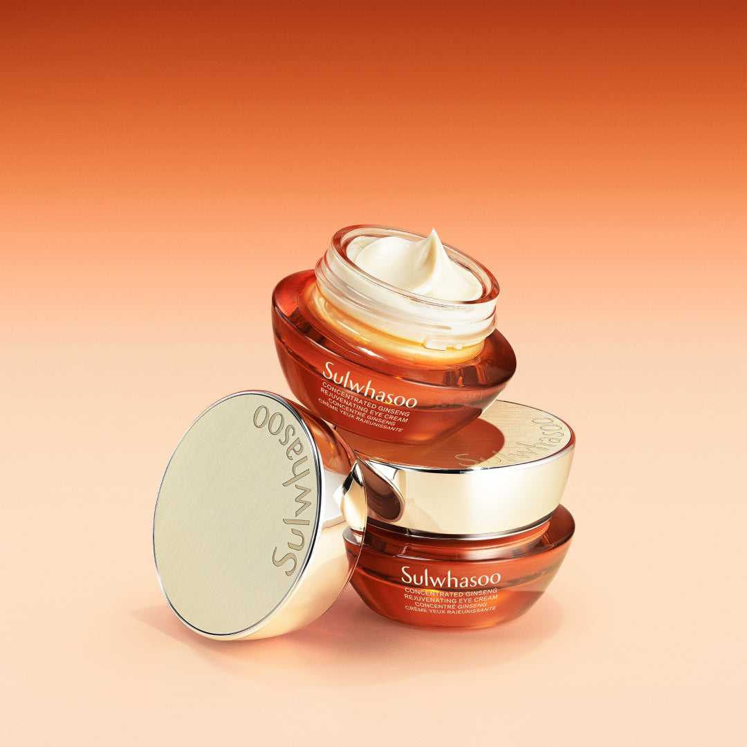 Sulwhasoo Concentrated Ginseng Rejuvenating Eye Cream, two jars on a gradient amber background