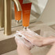 Enlarge image of Concentrated Ginseng Rejuvenating Cleansing Foam, hand model lathering foam between hands at the sink