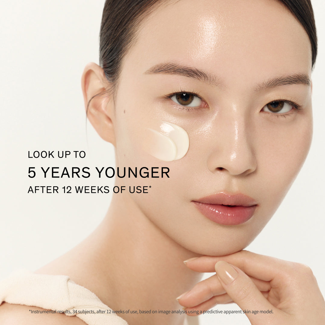 Close-up of model with a cream swatch on her cheek and text reading 'LOOK UP TO 5 YEARS YOUNGER AFTER 12 WEEKS OF USE'.