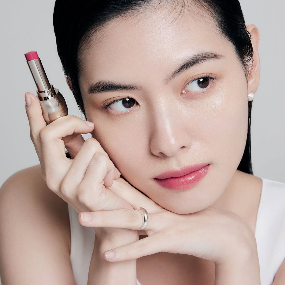 Fair skin beauty model holding and wearing product in shade NO.370 Peony