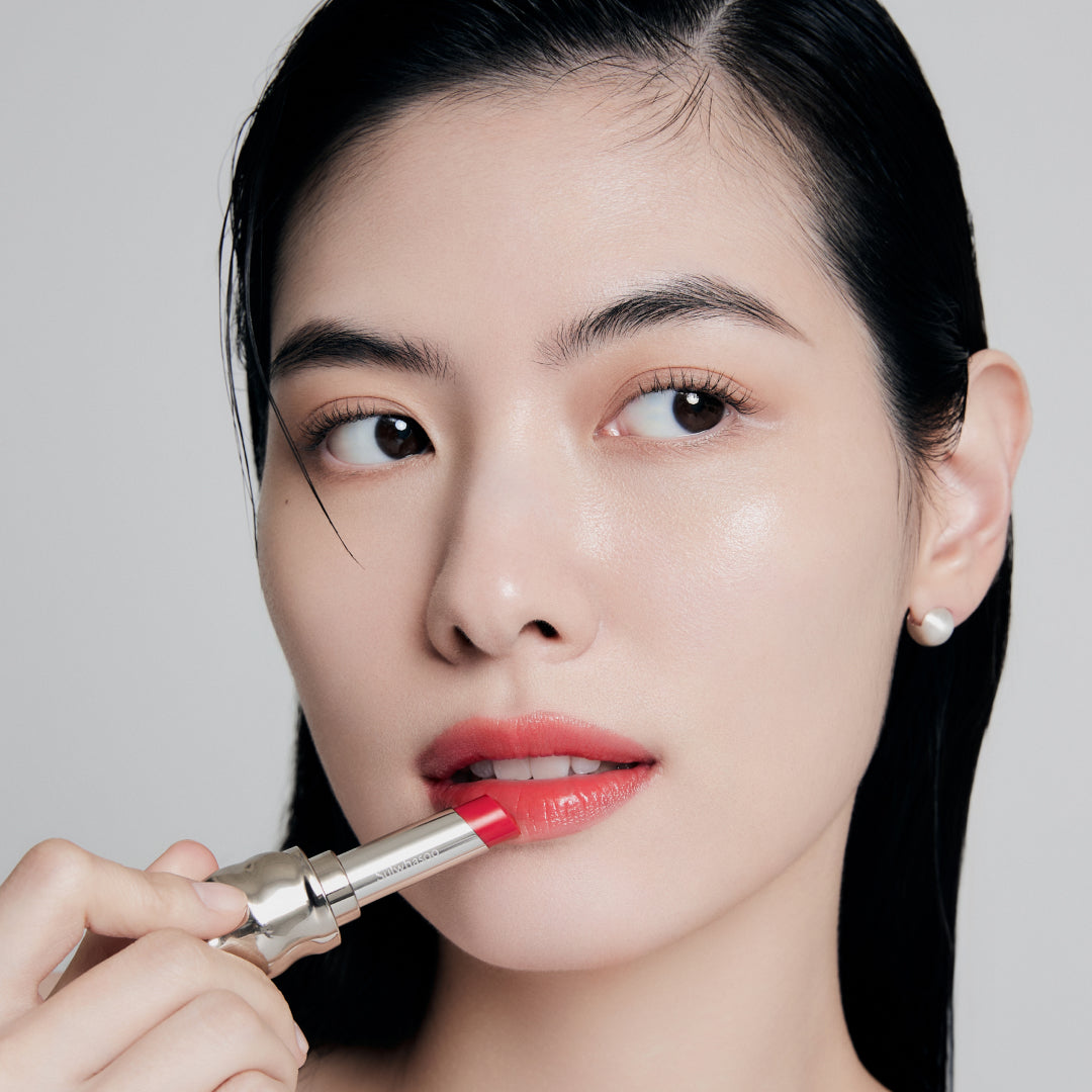 Fair skin beauty model holding and wearing product in shade NO.460 Berry