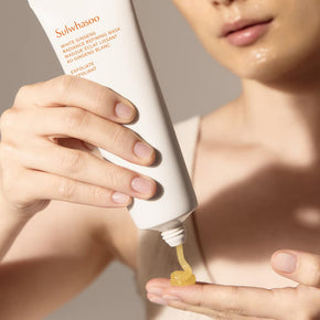 Sulwhasoo White Ginseng Radiance Refining Mask, Skincare Face Mask, model squeezing mask into hand