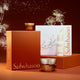 Enlarge image of Sulwhasoo skincare products including a jar, bottle, and box on an orange background with decorative elements.