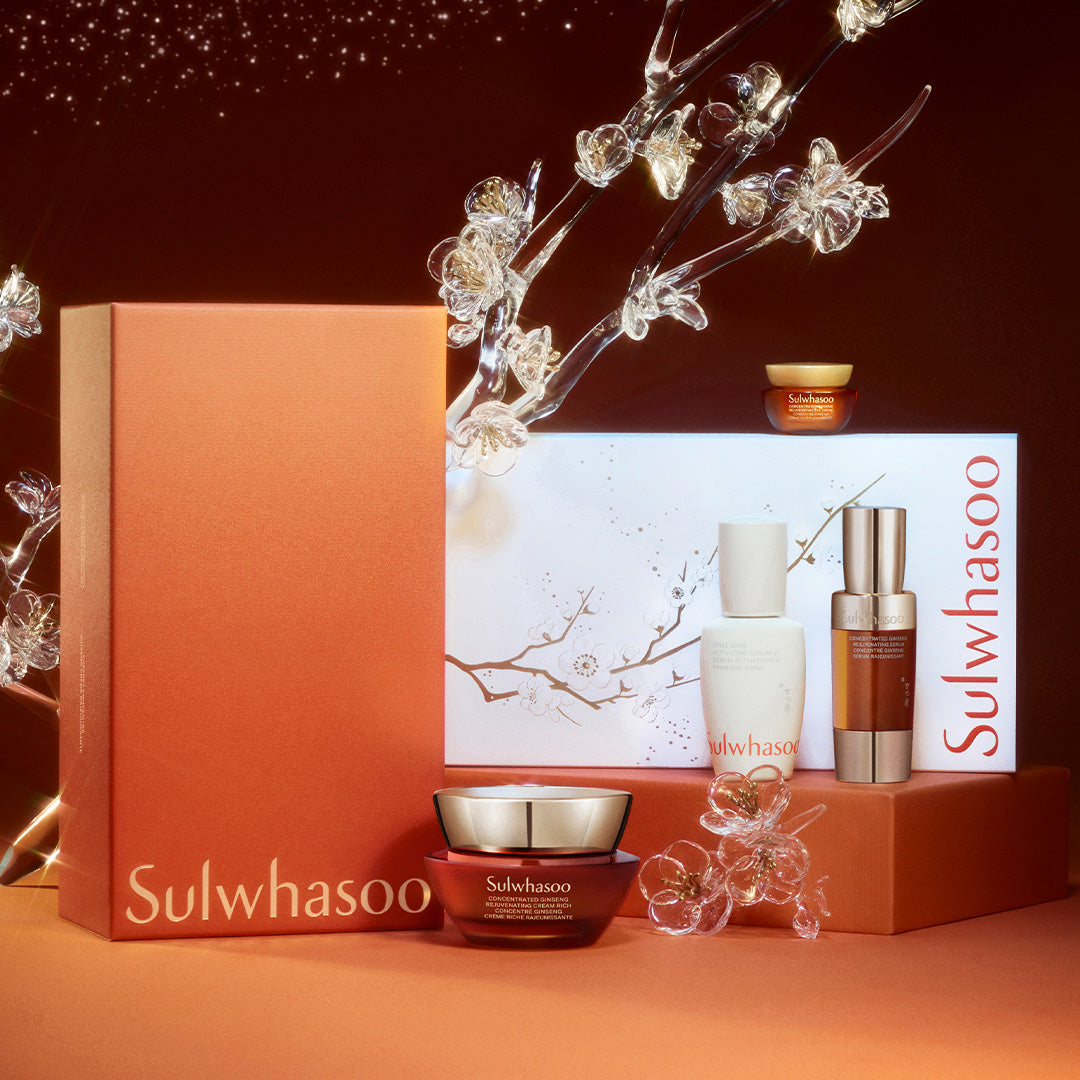 Sulwhasoo skincare products with decorative elements on a dark background
