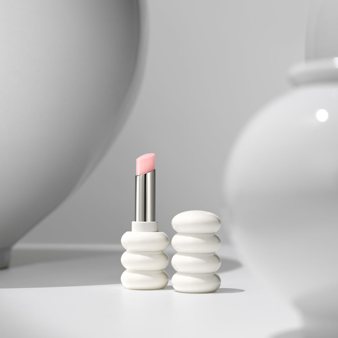 Lipstick with a unique white ceramic holder on a gray background