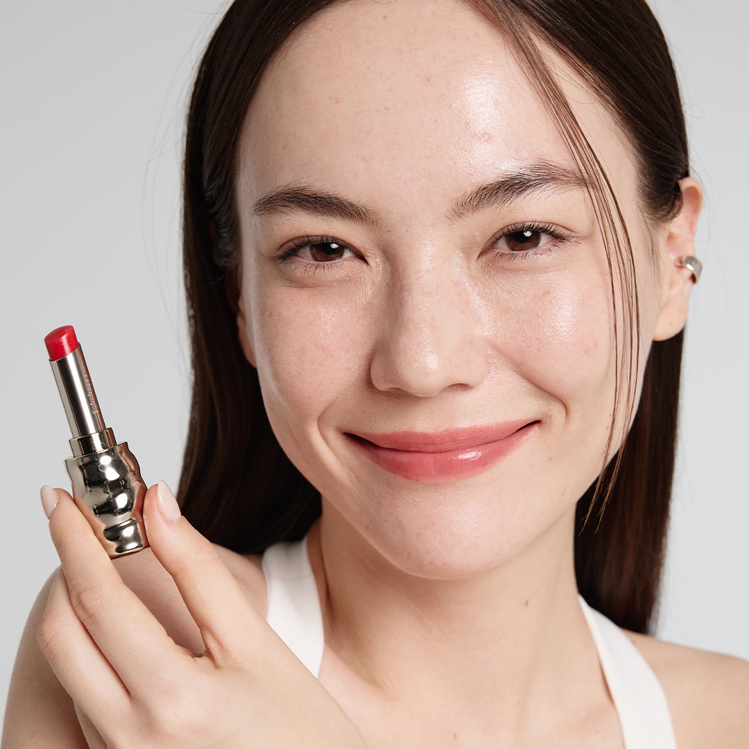 Light skin beauty model holding and wearing product in shade NO.460 Berry
