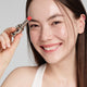 Enlarge image of Light skin beauty model holding and wearing product in shade NO.999 Rose