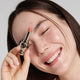 Enlarge image of Light skin beauty model holding and wearing product in shade NO.310 Terra