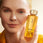 Sulwhasoo Concentrated Ginseng Renewing Water, Korean Ginseng Skincare, Beauty Water with model holding bottle